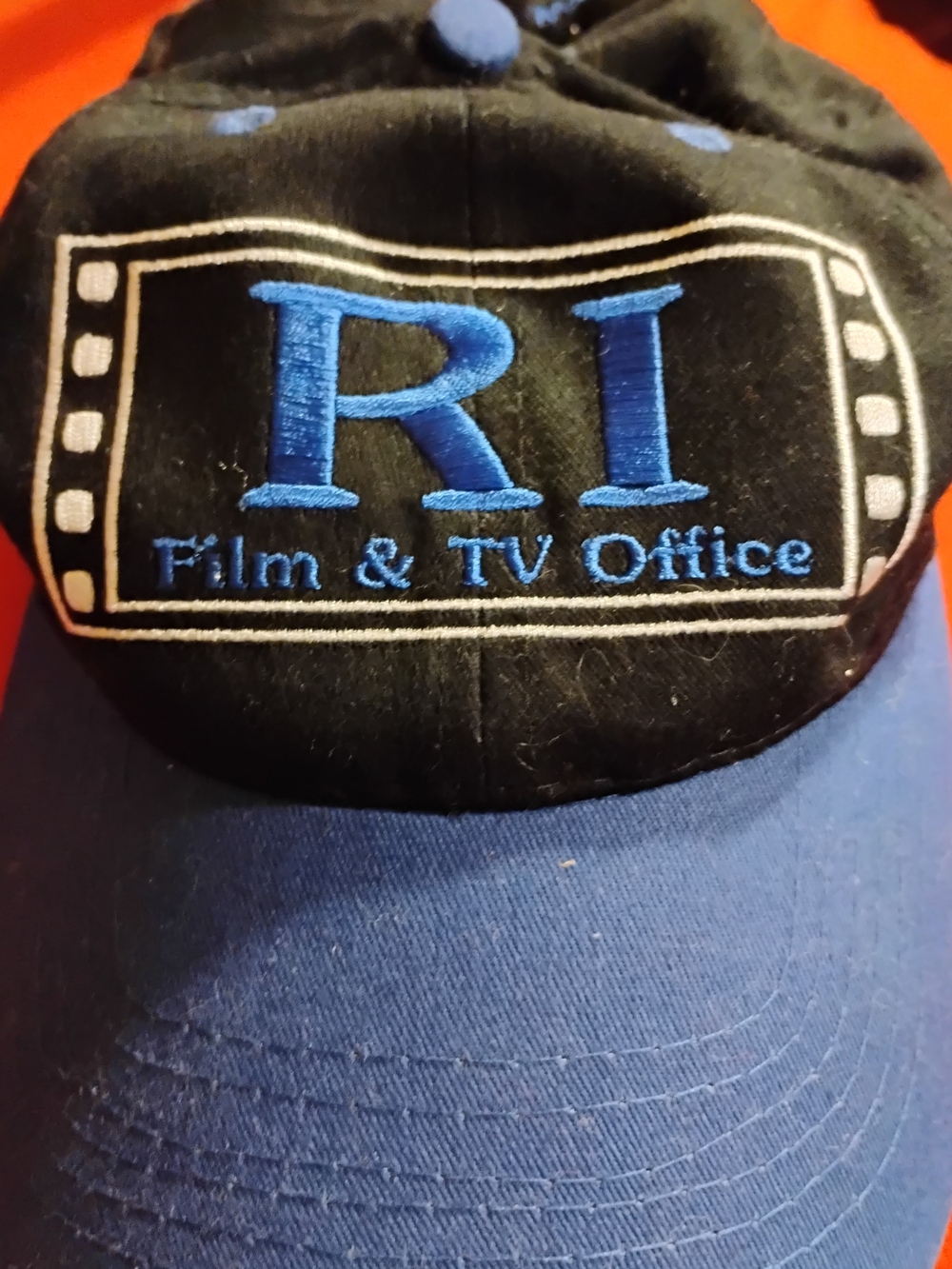 RI Film & TV Office Embroidered Baseball Cap in Black and Blue